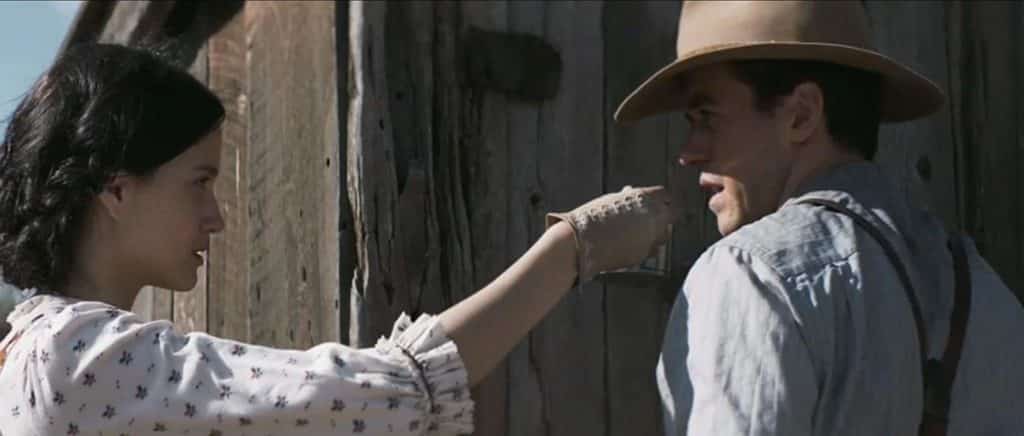 Emma Harper serving water to Isaac in The Wind