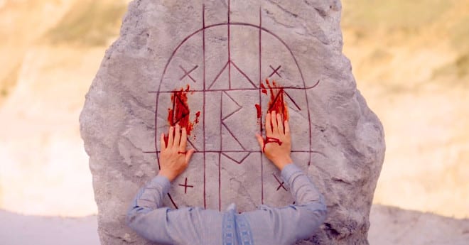 Runes smeared with blood in Midsommar review.