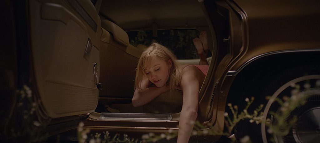 It Follows Maika Monroe in car