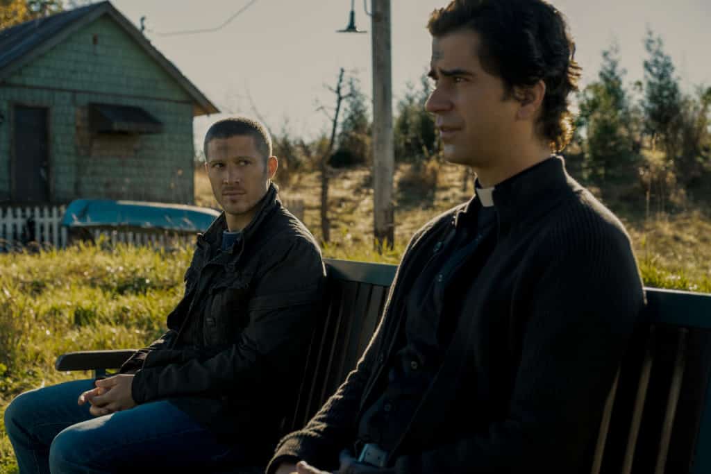 ZACH GILFORD as RILEY FLYNN and HAMISH LINKLATER as FATHER PAUL