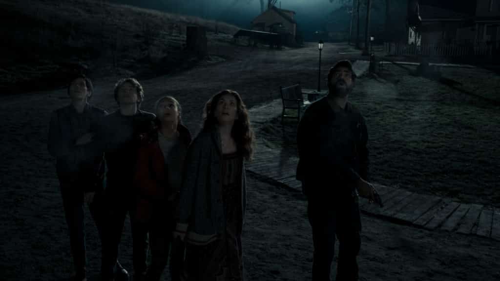 ANNABETH GISH as DR. SARAH GUNNING, IGBY RIGNEY as WARREN FLYNN, ANNARAH CYMONE as LEEZA SCARBOROUGH, KATE SIEGEL as ERIN GREENE, and RAHUL KOHLI as SHERIFF HASSAN in episode 107 of MIDNIGHT MASS