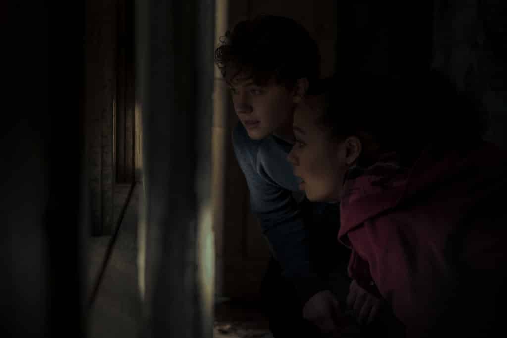 IGBY RIGNEY as WARREN FLYNN and ANNARAH CYMONE as LEEZA SCARBOROUGH in episode 107 of MIDNIGHT MASS 